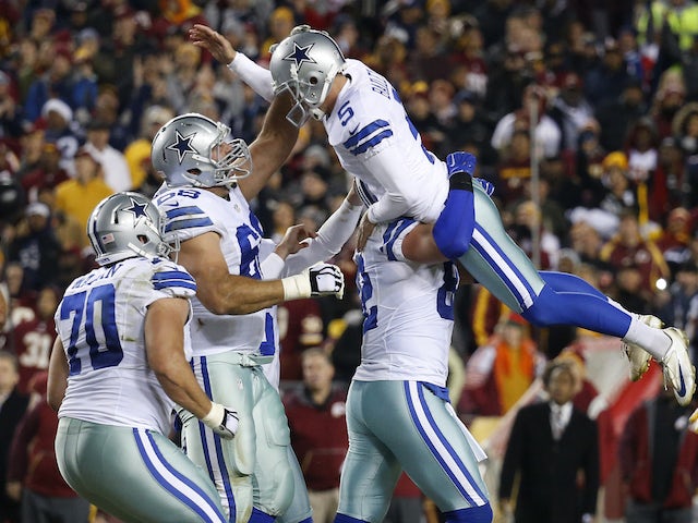 Tight end Jason Witten #82 of the Dallas Cowboys lifts up Dan Bailey #5 after Bailey kicked the game-winning field goal with seconds remaining to defeat the Washington Redskins 19-16 at FedExField on December 7, 2015 in Landover, Maryland.