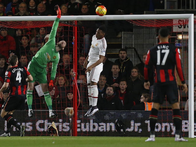 Manchester United's Spanish goalkeeper David de Gea (C) attempts to save a shot from Bournemouth's English midfielder Junior Stanislas (Not pictured) after he scored his team's first goal during the English Premier League football match between Bournemout