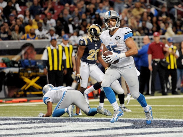 Golden Tate #15 of the Detroit Lions scores a touchdown in the fourth quarter against the St. Louis Rams at the Edward Jones Dome on December 13, 2015