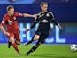 Bayern Munich's midfielder Joshua Kimmich (L) vies with Dinamo Zagreb's Portuguese defender Ivo Pinto during the UEFA Champions League football match between Dinamo Zagreb v Bayern Munich at the Maksimir stadium in Zagreb on December 9, 2015.