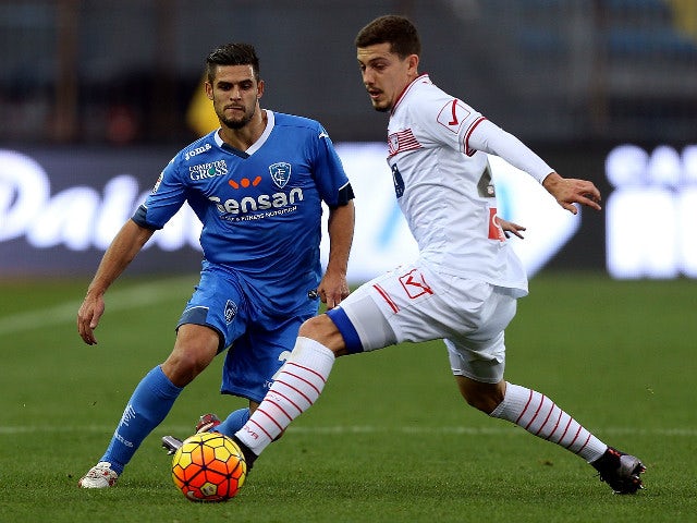 Vincent Laurini of Empoli FC battles for the ball with Martinho Raphael of Carpi FC during the Serie A match betweeen Empoli FC and Carpi FC at Stadio Carlo Castellani on December 13, 2015 in Empoli, Italy.
