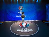 A picture shows the trophy of the UEFA Euro 2016 football tournament ahead of the final draw in Paris on December 12, 2016