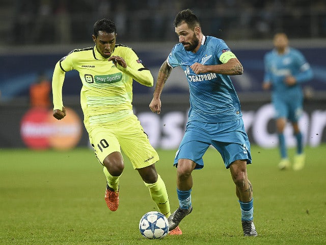 Gent's Brazilian midfielder Renato Neto (R) vies for the ball against Zenit's midfielder Danny during the UEFA Champions' League, Group H, football match KAA Gent vs FC Zenit on December 9, 2015 at the KAA Gent Stadium in Gent.