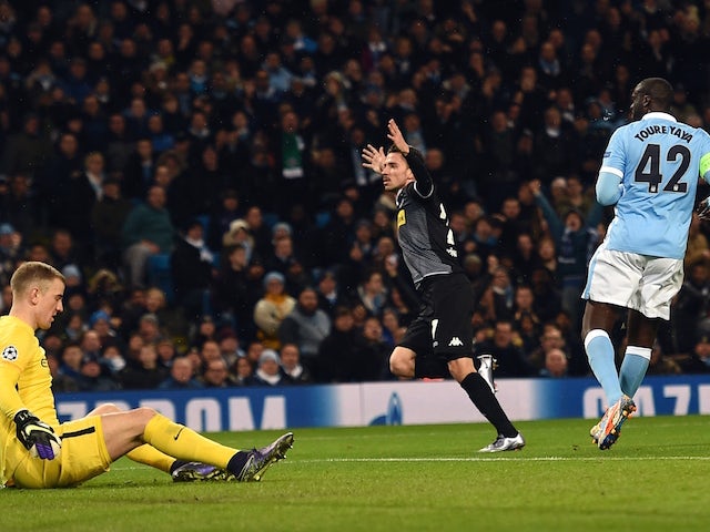 Moenchengladbach's German midfielder Julian Korb (C) celebrates scoring his team's first goal to equalise at 1-1 during the UEFA Champions League Group D football match between Manchester City and Borussia Moenchengladbach at the Etihad Stadium in Manches