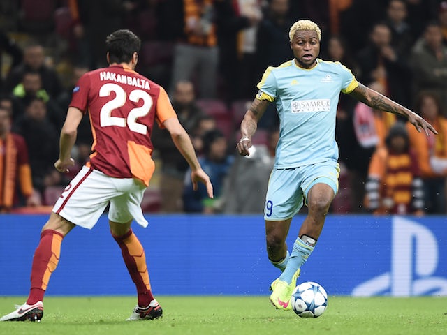 Astana's Congolese forward Junior Kabananga (R) and Galatasaray's Turkish defender Hakan Balta vie for the ball during the UEFA Champions League Group C football match between Galatasaray AS and FC Astana at the Turk Telekom Arena in Istanbul on December 