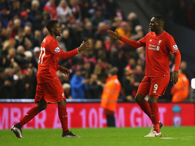 Divock Origi of Liverpool (L) celebrates with Christian Benteke as he scores their second goal during the Barclays Premier League match between Liverpool and West Bromwich Albion at Anfield on December 13, 2015