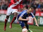 Albert Adomah of Middlesbrough fouls Luke Varney of Ipswich Town during the Sky Bet Championship match between Middlesbrough and Ipswich Town at the Riverside Stadium on March 14, 2015