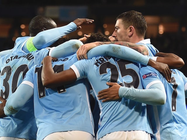 Manchester City players celebrate after Manchester City's English midfielder Raheem Sterling (R) scored his second and City's third goal to take the lead 3-2 during the UEFA Champions League Group D football match between Manchester City and Borussia Moen