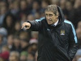 Manchester City's Chilean manager Manuel Pellegrini gestures from the touchline during the English Premier League football match between Manchester City and Swansea City at the Etihad Stadium in Manchester, north west England, on December 12, 2015