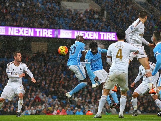Wilfred Bony (C) of Manchester City scores his team's first goal during the Barclays Premier League match between Manchester City and Swansea City at Etihad Stadium on December 12, 2015