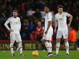 Juan Mata, Anthony Martial and Michael Carrick of Manchester United show their dejection after conceding second goal to Bournemouth during the Barclays Premier League match between A.F.C. Bournemouth and Manchester United at Vitality Stadium on December 1