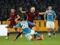 Kalidou Koulibaly (L) of Napoli competes for the ball with Edin Dzeko of Roma during the Serie A match betweeen SSC Napoli and AS Roma at Stadio San Paolo on December 13, 2015