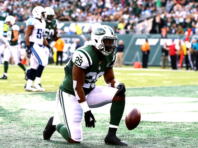 Bilal Powell #29 of the New York Jets celebrates scoring a touchdown in the second quarter against the Tennessee Titans during their game at MetLife Stadium on December 13, 2015