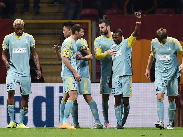 Astana's Ghanaian forward Patrick Twumasi (2nd R) celebrates with teammates after scoring a goal during the UEFA Champions League Group C football match between Galatasaray AS and FC Astana at the Turk Telekom Arena in Istanbul on December 8, 2015.