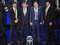 Representatives of teams drawn in group B (L-R) Slovakia's assistant coach Stefan Tarkovic, England's coach Roy Hodgson, Russia's coach Leonid Slutski and Wales' coach Chris Coleman pose with the trophy after the final draw of the UEFA Euro 2016 football 
