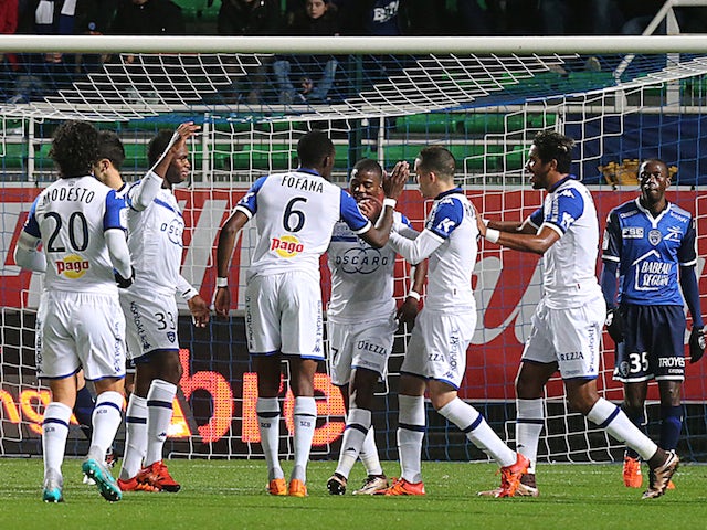 Bastia's players celebrate after Bastia's French midfielder Seko Fofana (C) scored a goal during the French L1 football match between Troyes and Bastia on December 12, 2015 at the Aube Stadium in Troyes.