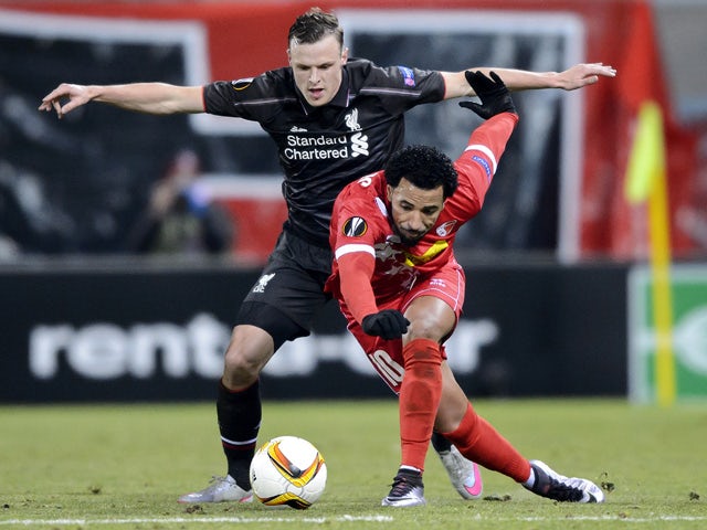 Liverpool's Australian defender Brad Smith (L) and Sion's Portugese midfielder Carlitos vie for the ball during the UEFA Europa League group B football match between FC Sion and FC Liverpool at the Tourbillon stadium in Sion on December 10, 2015