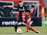 Liverpool's Australian defender Brad Smith (L) and Sion's Portugese midfielder Carlitos vie for the ball during the UEFA Europa League group B football match between FC Sion and FC Liverpool at the Tourbillon stadium in Sion on December 10, 2015