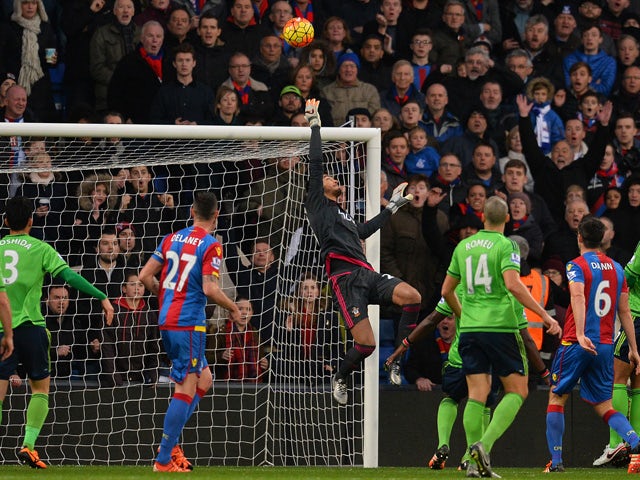 Southampton's Argentinian goalkeeper Paulo Gazzaniga (C) jumps to make a save during the English Premier League football match between Crystal Palace and Southampton at Selhurst Park in south London on December 12, 2015