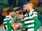 Sporting's Algerian forward Islam Slimani (R) celebrates with his teammates after scoring during the Portuguese league football match Sporting CP vs Moreirense FC at the Jose Alvalade stadium in Lisbon on December 13, 2015
