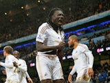 Bafetimbi Gomis of Swansea City celebrates scoring his team's first goal during the Barclays Premier League match between Manchester City and Swansea City at Etihad Stadium on December 12, 2015