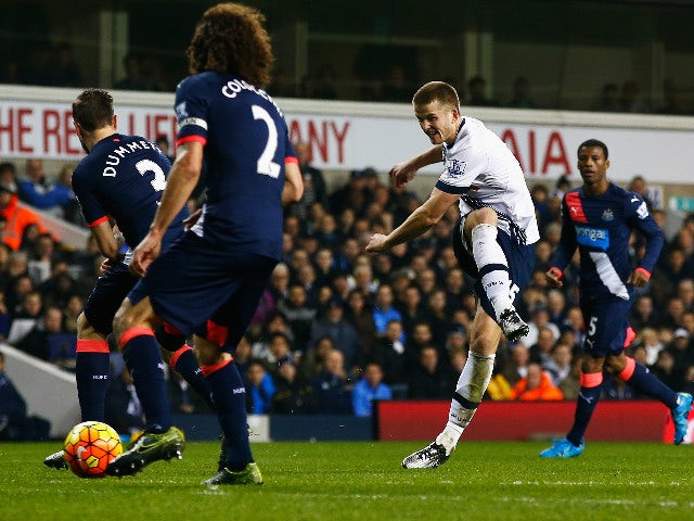 ric Dier of Tottenham Hotspur shoots past Paul Dummett of Newcastle United during the Barclays Premier League match between Tottenham Hotspur and Newcastle United at White Hart Lane on December 13, 2015 in London, England.