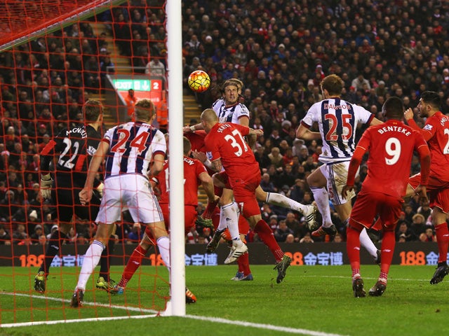 Jonas Olsson of West Bromwich Albion (C) scores their second goal during the Barclays Premier League match between Liverpool and West Bromwich Albion at Anfield on December 13, 2015