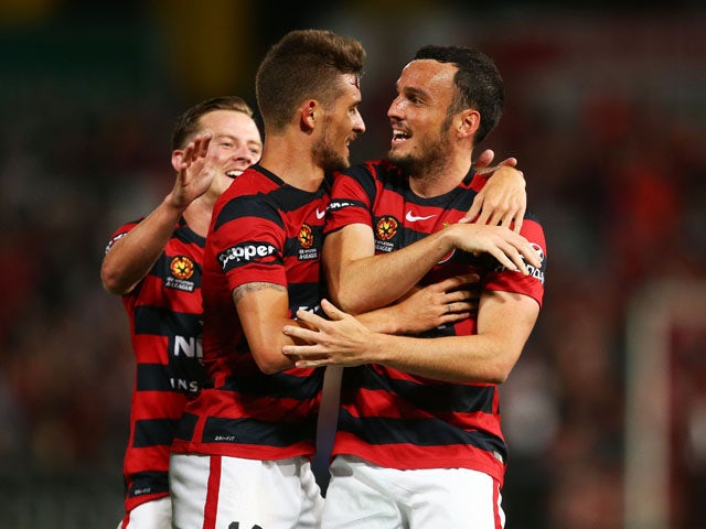 Mark Bridge (R) of the Wanderers celebrates with Dario Vidosic of the Wanderers (L) after scoring the first goal during the round 10 A-League match between the Western Sydney Wanderers and Melbourne Victory at Pirtek Stadium on December 12, 2015