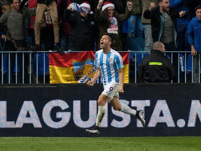 'Charles' celebrates scoring for Malaga against Atletico Madrid on December 20, 2015