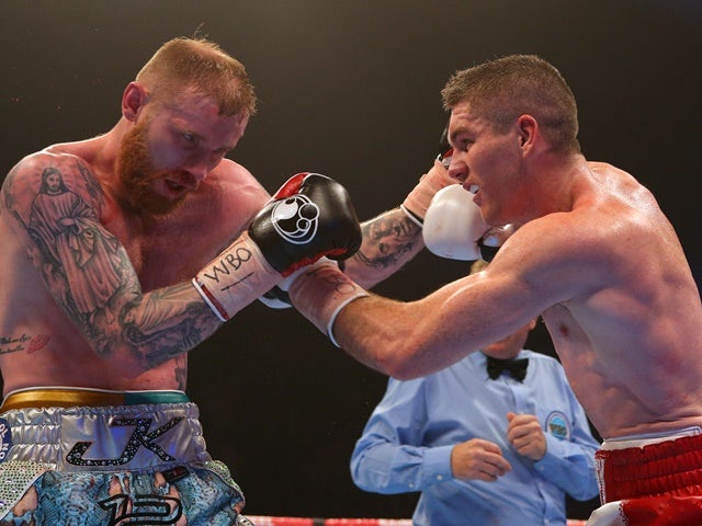 Liam Smith and Jimmy Kelly in their WBO world super welterweight title bout at the Manchester Arena on December 19, 2015