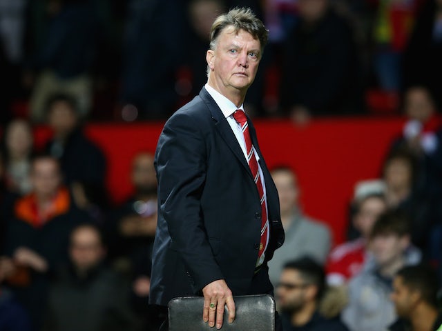 Manchester United boss Louis van Gaal leaves the pitch after watching his side fall 2-1 to Norwich on December 19, 2015