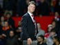 Manchester United boss Louis van Gaal leaves the pitch after watching his side fall 2-1 to Norwich on December 19, 2015