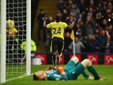 Odion Ighalo celebrates scoring Watford's third as Liverpool's ginger keeper Adam Bogdan lies dejected on December 20, 2015