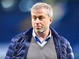 Chelsea owner Roman Abramovich steps onto the pitch at Stamford Bridge after the 3-1 win over Sunderland on December 19, 2015