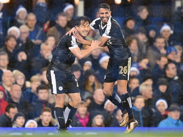 Shinji Okazaki celebrates scoring Leicester's third against Everton with Riyad Mahrez on December 19, 2015