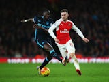 Aaron Ramsey of Arsenal skips past Yaya Toure of Manchester City during the Gunners' 2-1 victory at the Emirates Stadium on December 21, 2015