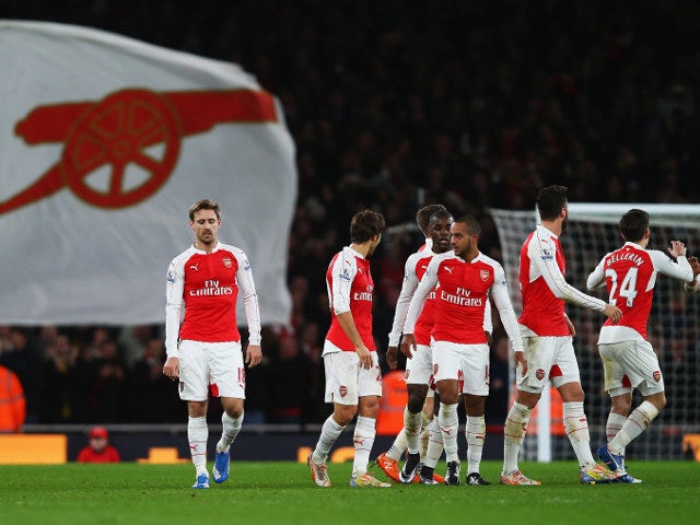 Arsenal celebrate after taking the lead during their Premier League clash with Manchester City at the Emirates Stadium on December 21, 2015