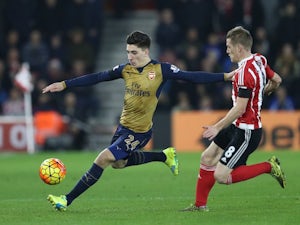 Arsenal defender Hector Bellerin is chased down by Steven Davis of Southampton on December 26, 2015