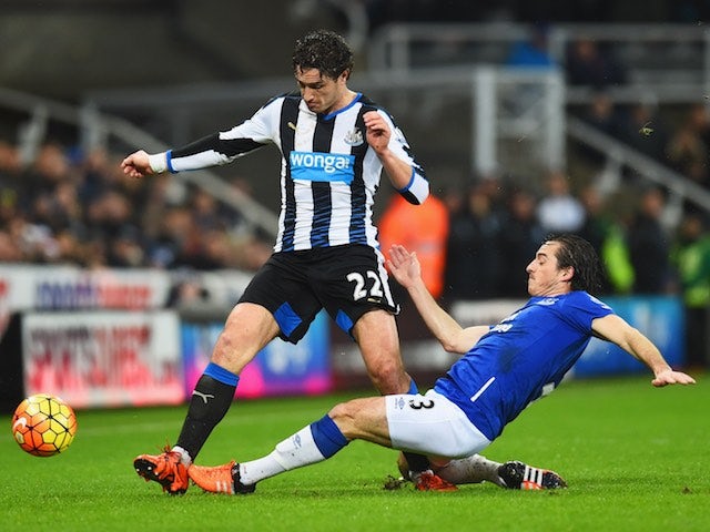 Everton's Leighton Baines slides in Daryl Janmaat of Newcastle on December 26, 2015
