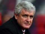 Mark 'Bah Humbug' Hughes watches on during the game between Manchester United and Stoke City on December 26, 2015