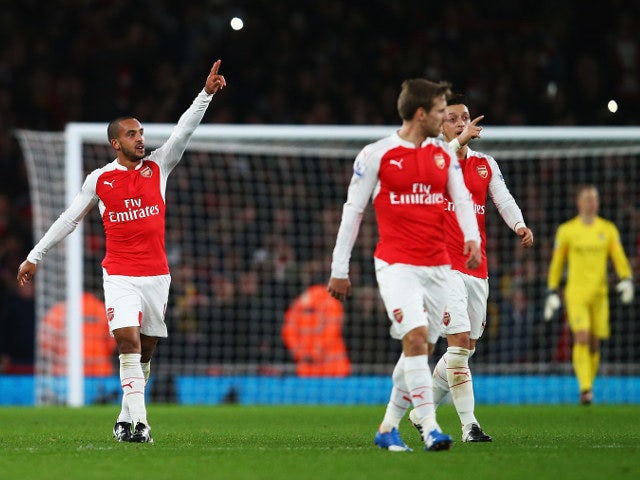 Arsenal's Theo Walcott celebrates after opening the scoring for his side during the 2-1 victory over Manchester City on December 21, 2015