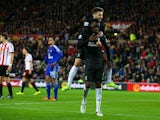 Adam Lallana mounts Christian Benteke after he scores during the game between Sunderland and Liverpool on December 30, 2015