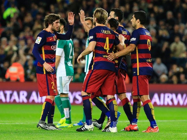 Barcelona players celebrate the first goal during the game with Real Betis on December 30, 2015