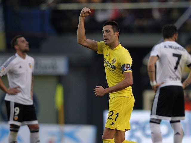 Bruno Soriano reveals a disturbingly small bicep after scoring during the game between Villarreal and Valencia on December 31, 2015