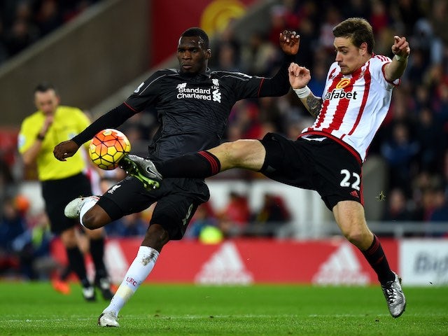 Christian Benteke and Sebastian Coates in action during the game between Sunderland and Liverpool on December 30, 2015