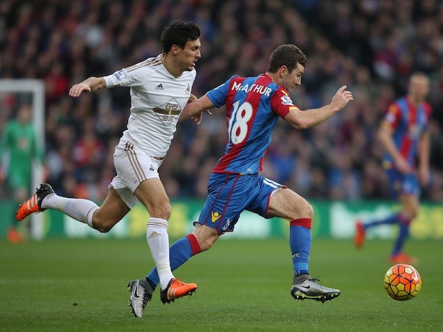 Crystal Palace's James McArthur is pursued by Jack Cork of Swansea on December 28, 2015