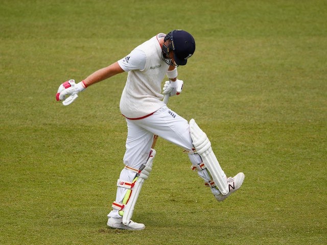 Joe Root reacts after seeing his wicket fall on day four of the first Test between South Africa and England on December 29, 2015