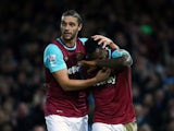 Goal scorers Michail Antonio and huge Andy Carroll celebrate during West Ham's win over Southampton on December 28, 2015