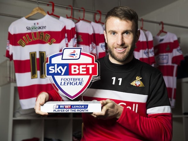 Andy Williams of Doncaster Rovers poses with his Player of the Month award for December 2015