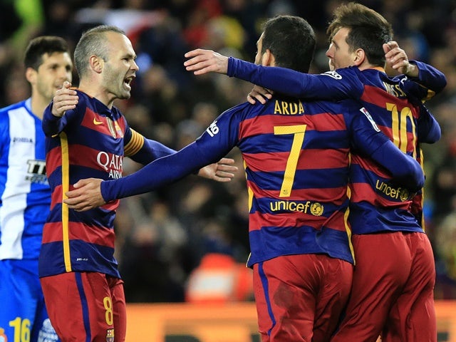 Barcelona's Lionel Messi celebrates with teammates after scoring during the Copa del Rey round-of-16 first leg against Espanyol at Camp Nou on January 6, 2016